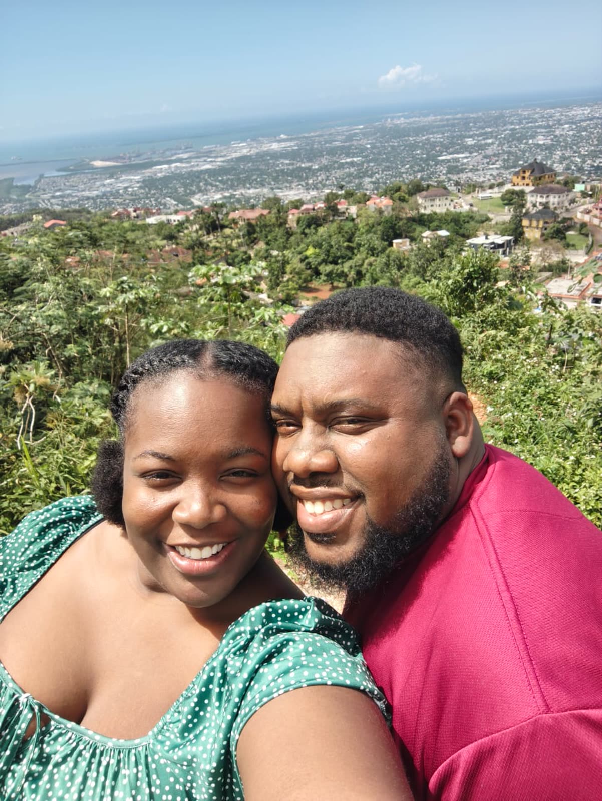 Desmarie and Joanson on a hillside overlooking Kingston